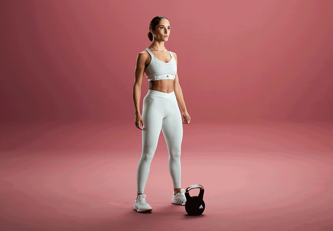 francheska-standingupstraightwithakettlebellatherfit