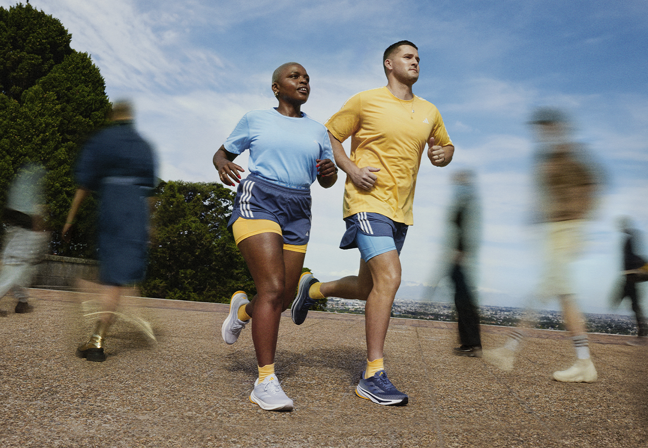 Image of two people running outdoors wearing Supernovas.