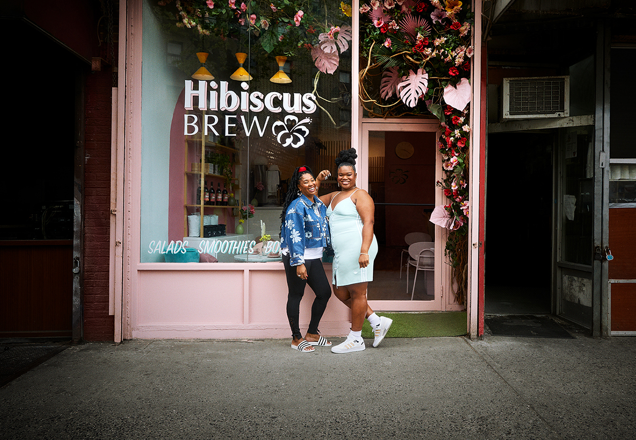 Jari Jones with owner of her Always Original Shop, Hibiscus Brew. Jari wears the Always Original Strap Dress and Forum Low shoes. Allison wears the Always Original Laced Tee, High Waisted Leggings and Adilette slides.