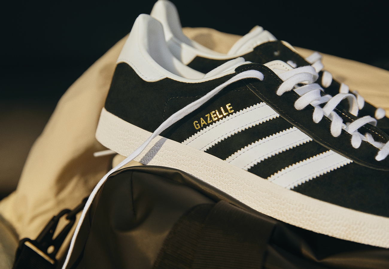 Close-up image of black adidas Gazelles.