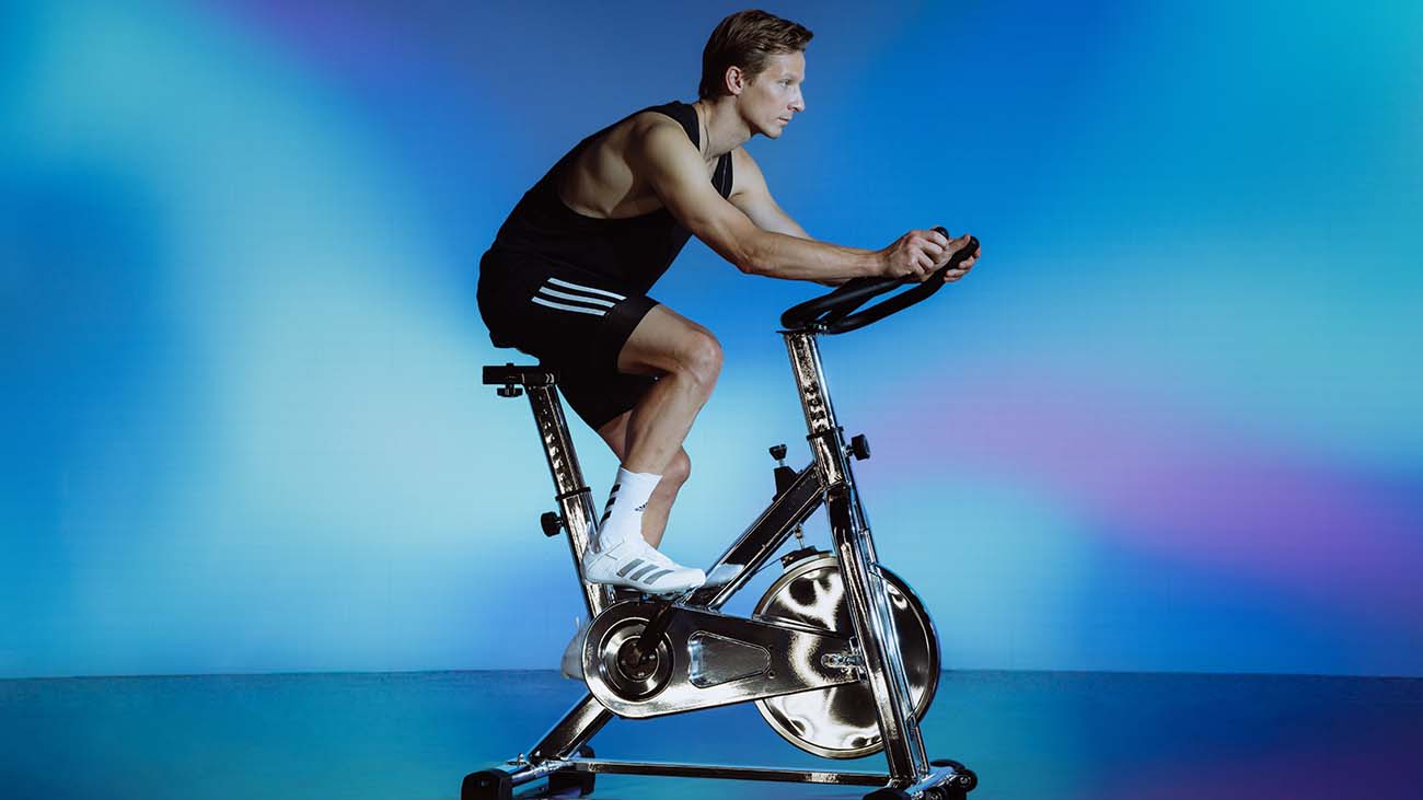 A male cyclist working out on an exercise bike