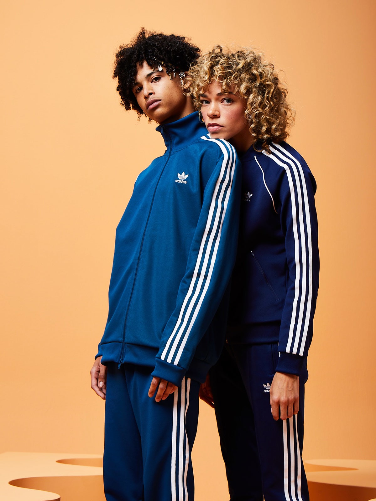 men and women matching tracksuits