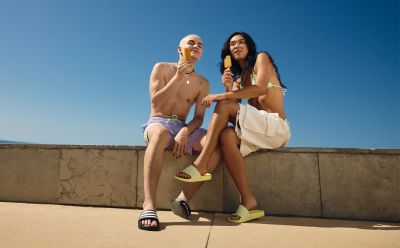 adidas-models-in-swimwear-sitting-on-sandy-beach