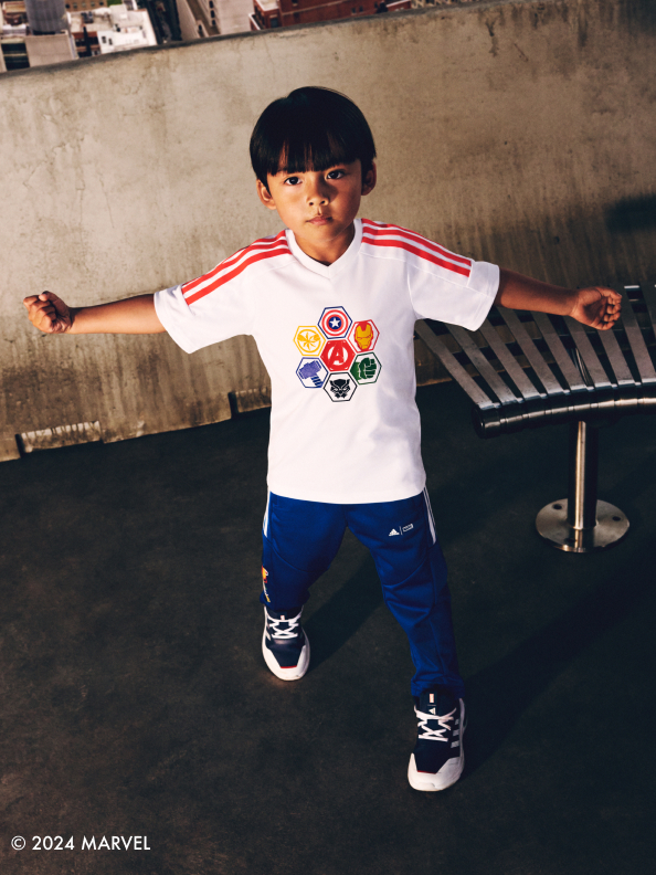 Child with arms open wearing the adidas | Avengers collection