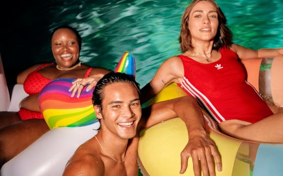 adidas-three-models-in-swimming-lounging-in-swim-floats-red-swimsuit