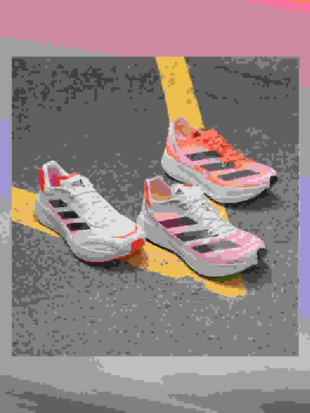Adizero running shoes on the street with text