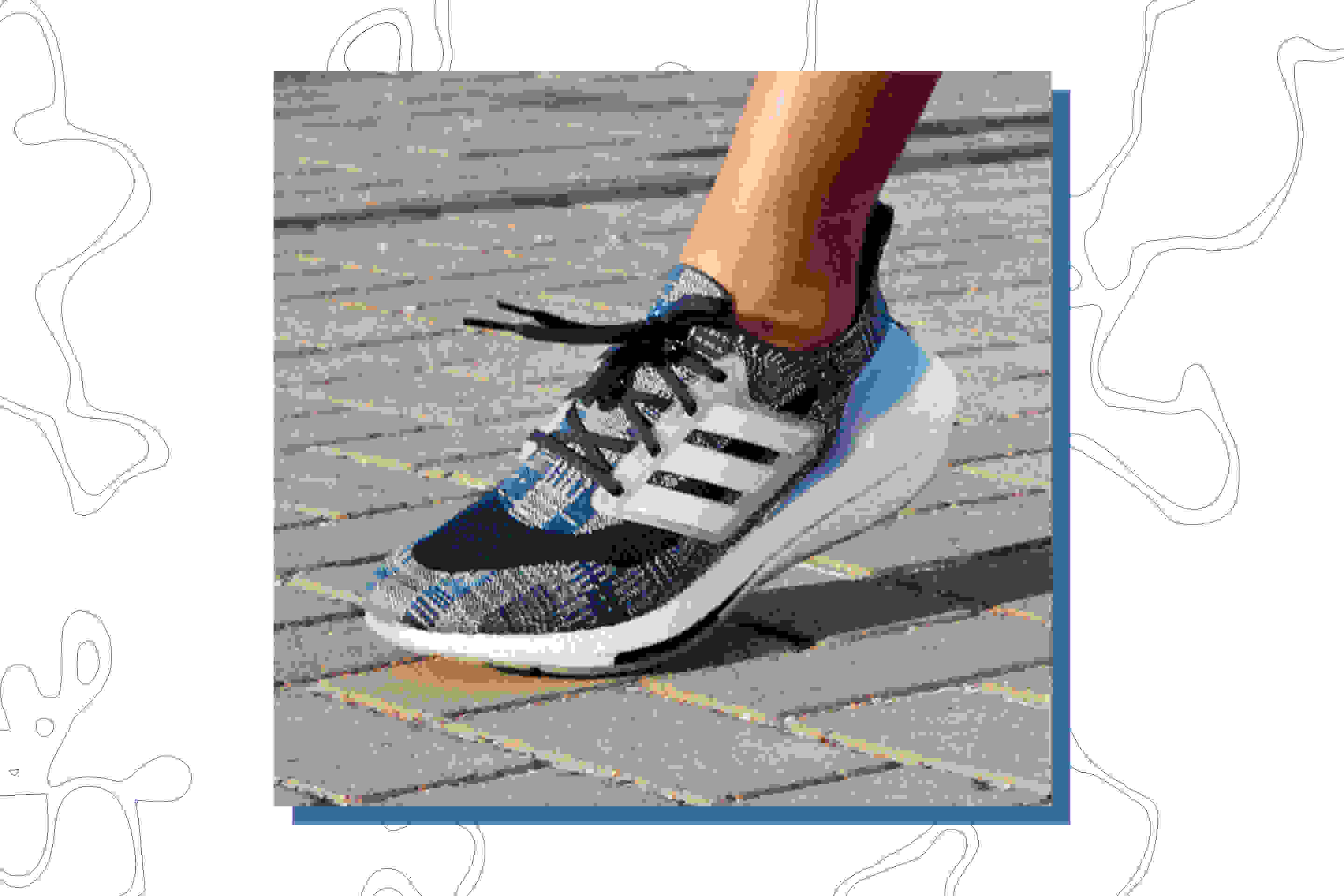 A woman is wearing Primeblue Ultraboost 21 shoes