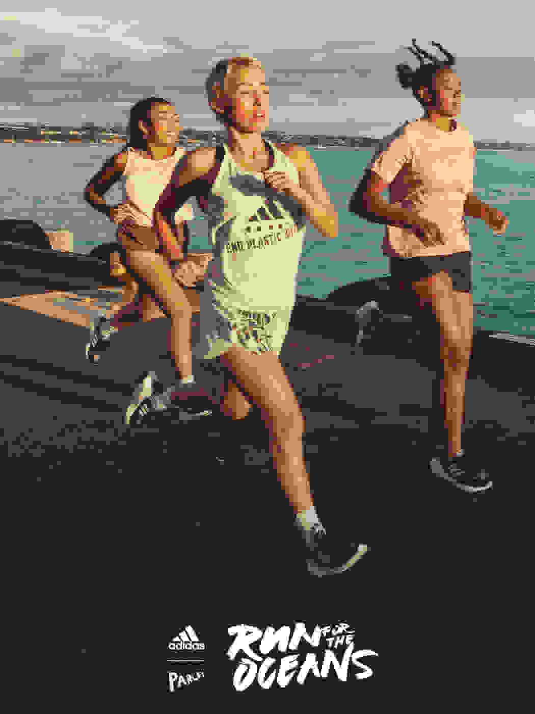 Group of women running by the ocean