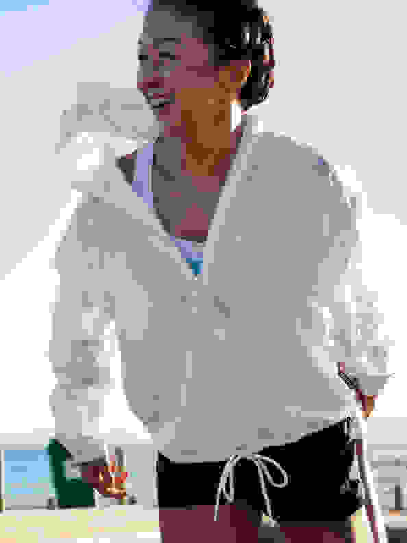 A woman is warming up to get ready for Run For The Oceans