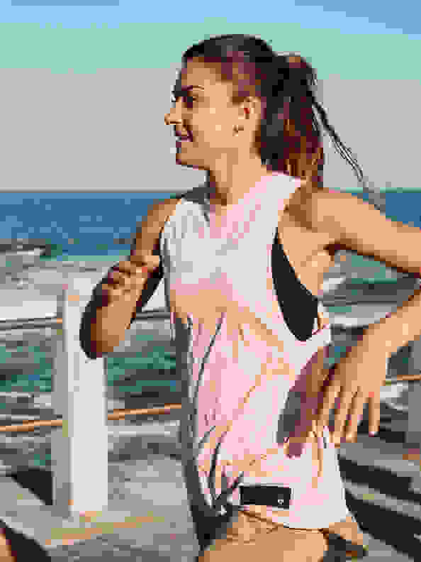 A woman is warming up to get ready for Run For The Oceans