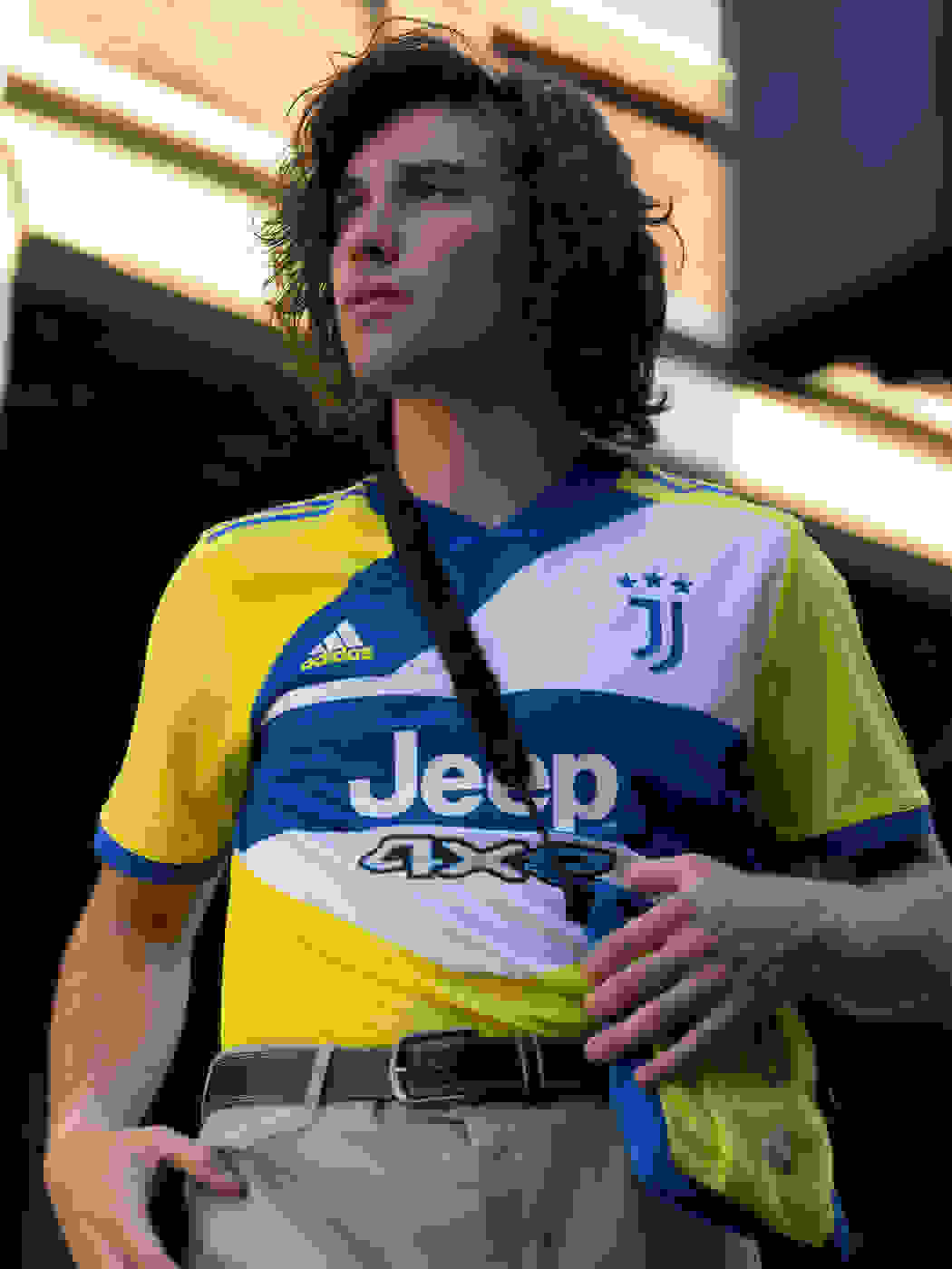 A male fan wearing the Juventus Third kit