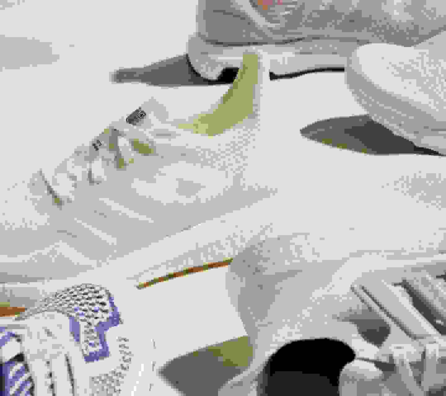 The SS21 sustainable Ultraboost models on a light surface with notable shadows.