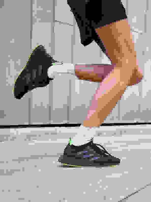 Close up of person running with the new adidas 4DFWD running shoe.