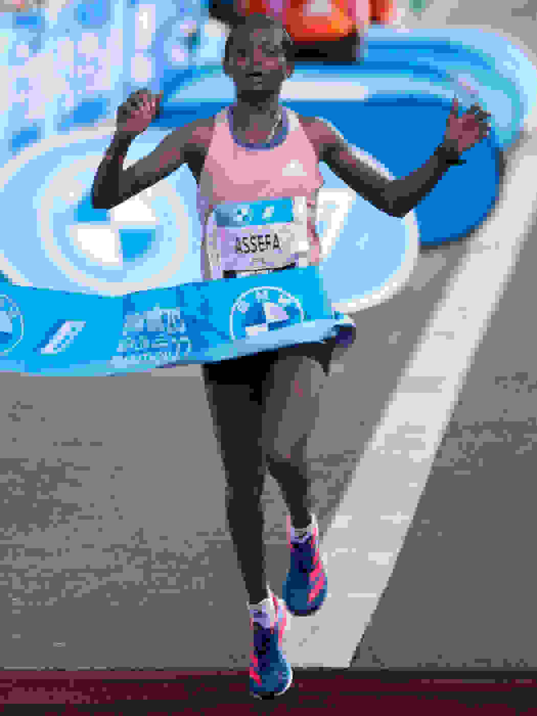 Image of athlete crossing the finish line.