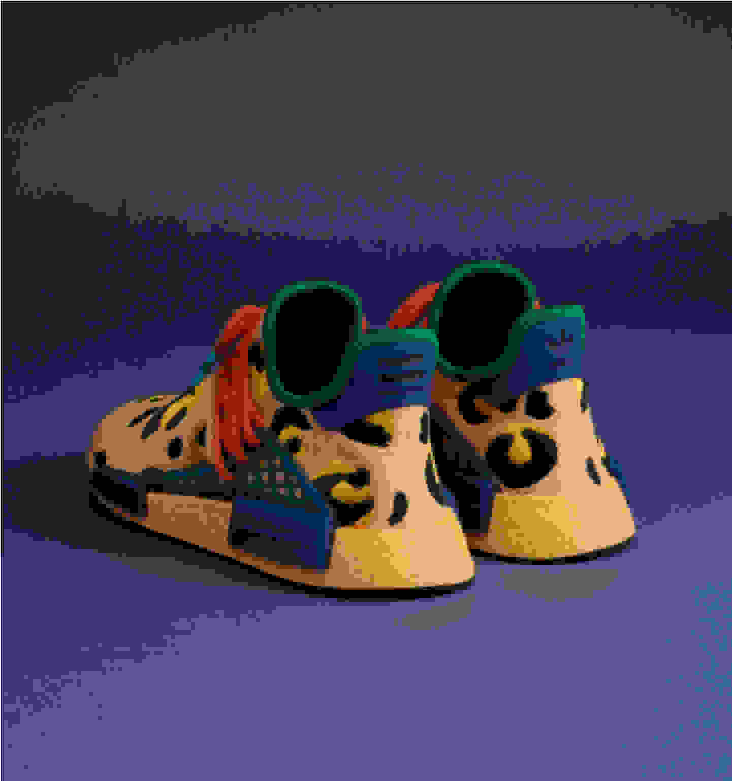 Rear view of pair of amber animal print shoes on blue background.