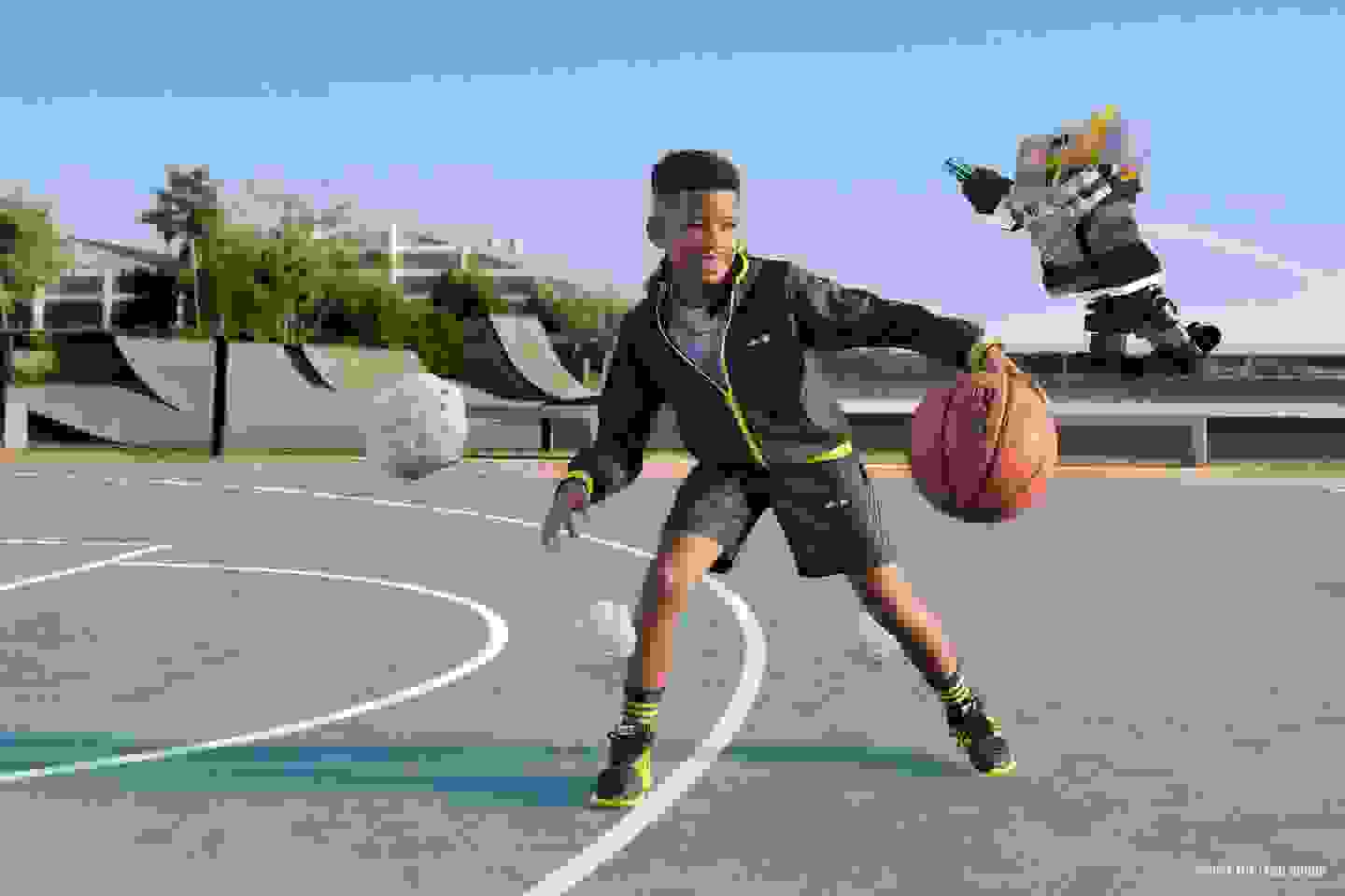 Smiling boy dribbling basketball around asteroids and a flying robot