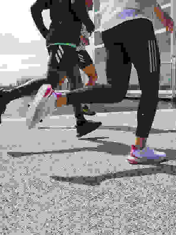 Woman and man running with the new adidas 4DFWD running shoe.