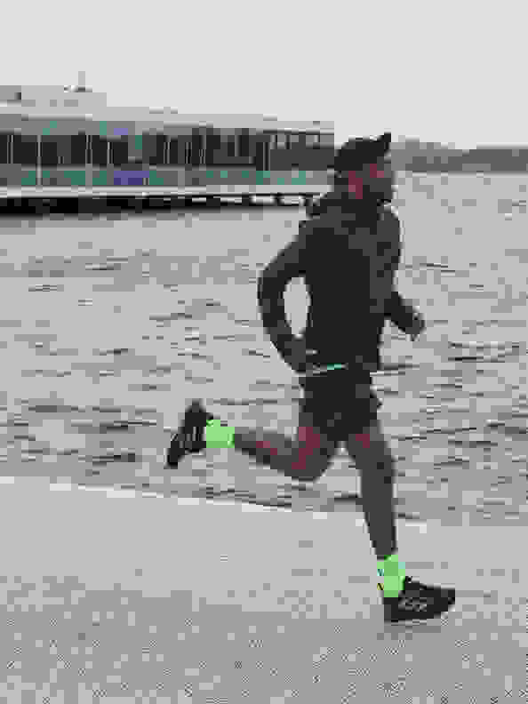 Side view of man running with the new adidas 4DFWD running shoe.