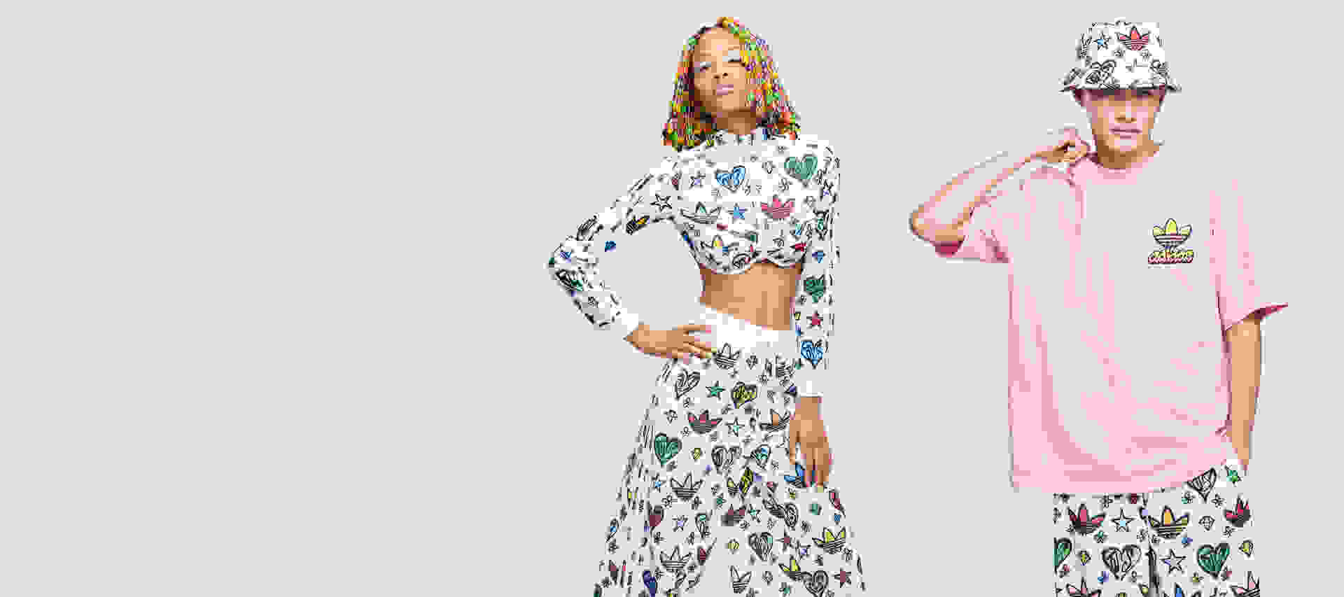 Models posing in the Jeremy Scott Monogram colourful collection.