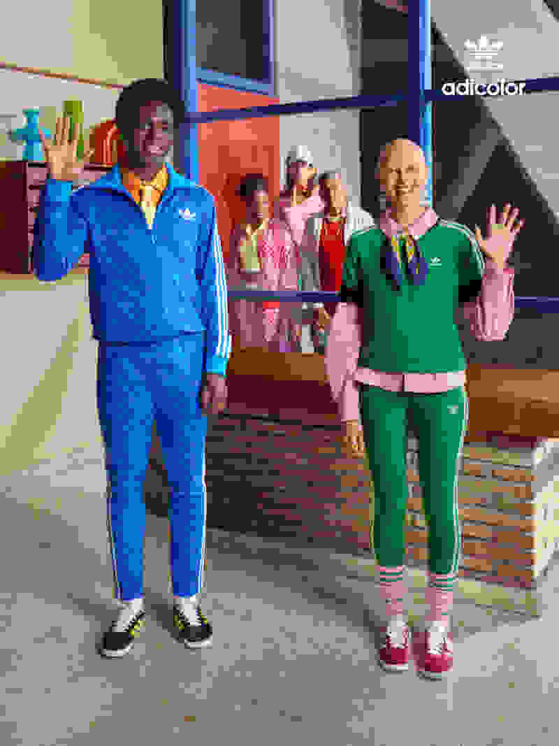 Group of people wearing adicolor 70s waving to camera
