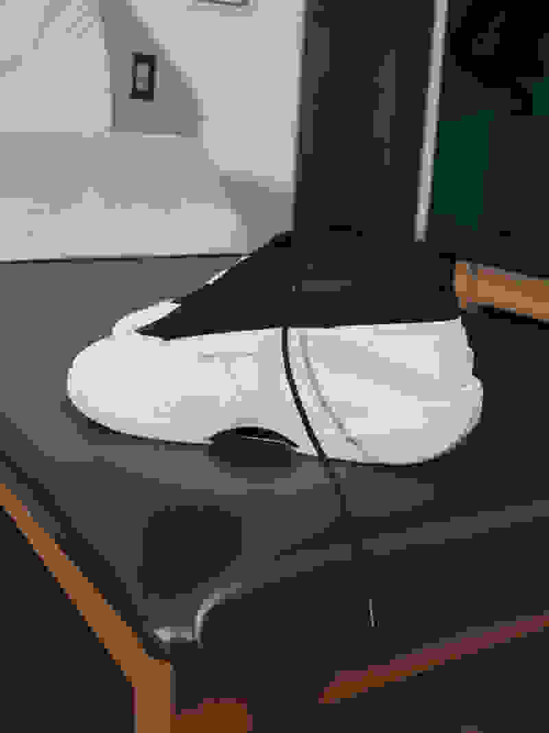 Black and white shoe side profile view