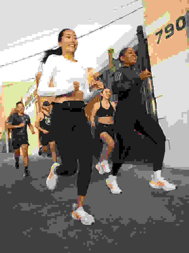Image of a group of women running in the Solarglide 5 shoe