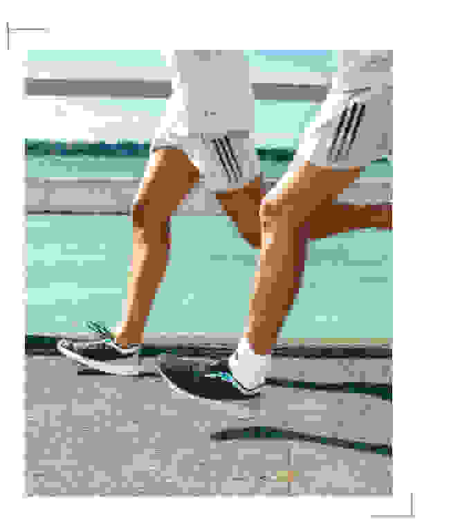 A close up of people running in the adizero Parley shoe