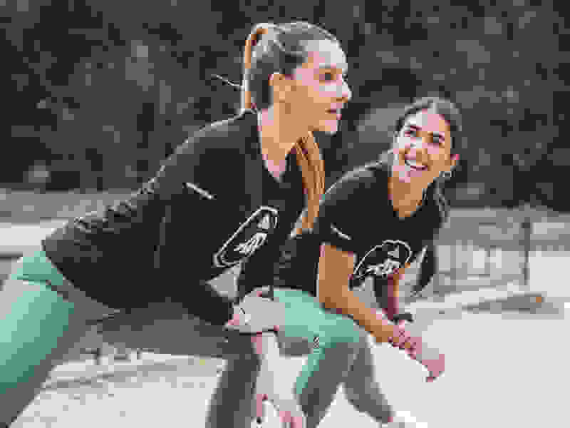 Two women stretching