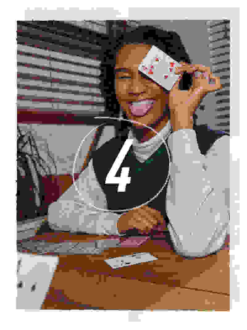 An image with a hero holding a playing card in his hand in the background and the number 4 in the foreground
