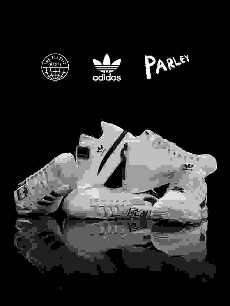 adidas originals stacked on top of each other with a black background