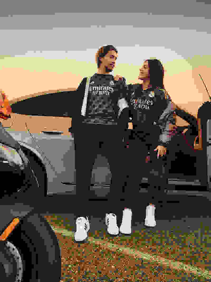 Visual featuring a Male and Female fan wearing the new 23/24 Real Madrid Away kit.
