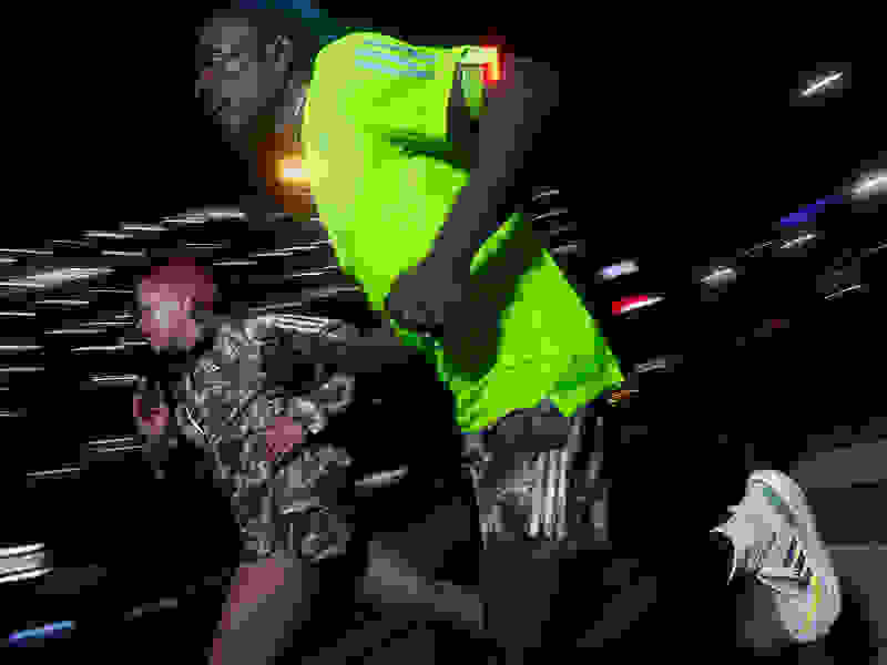 Close-up of runner running in Ultraboost Light shoes.