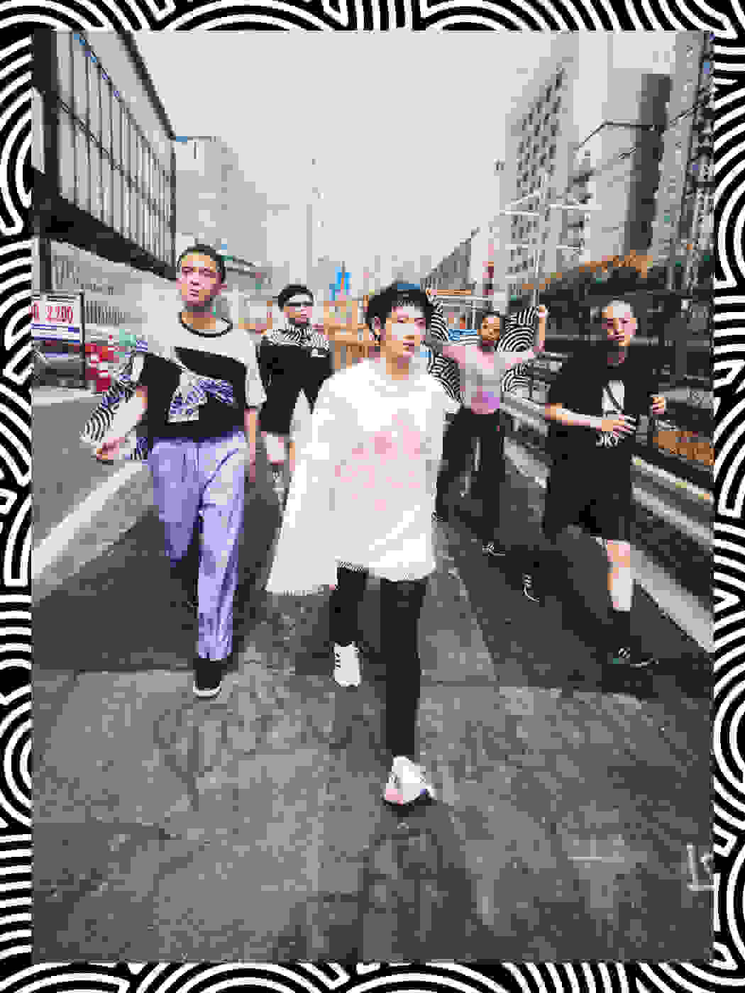 A group of young Tokyoites wearing items from HIROKO TAKAHASHI COLLECTION are walking along the street in Tokyo. Their energy is connected with each other and heading towards the same direction.