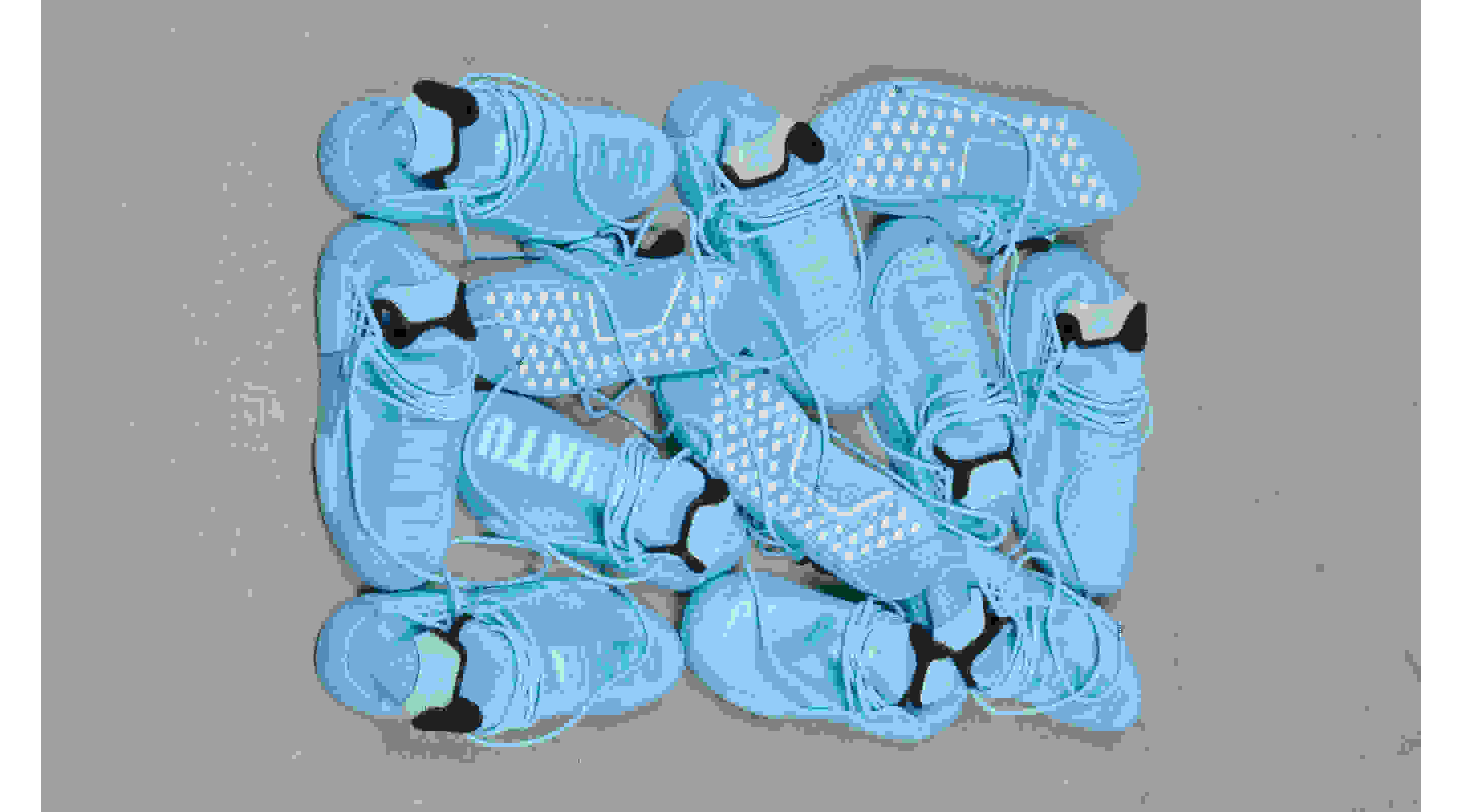 An overhead shot of a jumble of twelve bright blue HU NMD shoes, showcasing the silhouette's Primeknit upper and textured outsole.