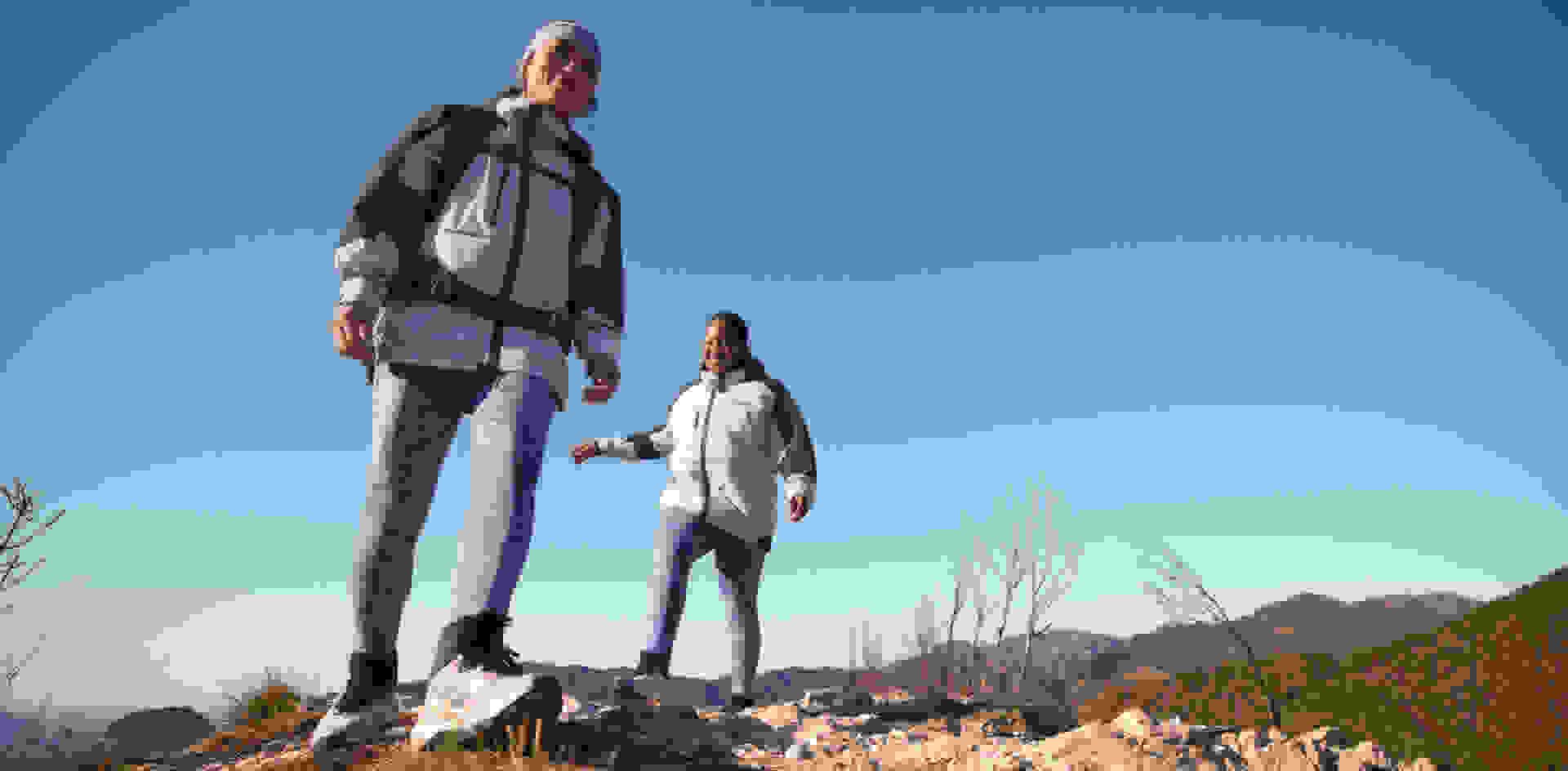 2 Women wearing the woman hiker apparel and TERREX WMN RAIN.RDY hiking shoes
