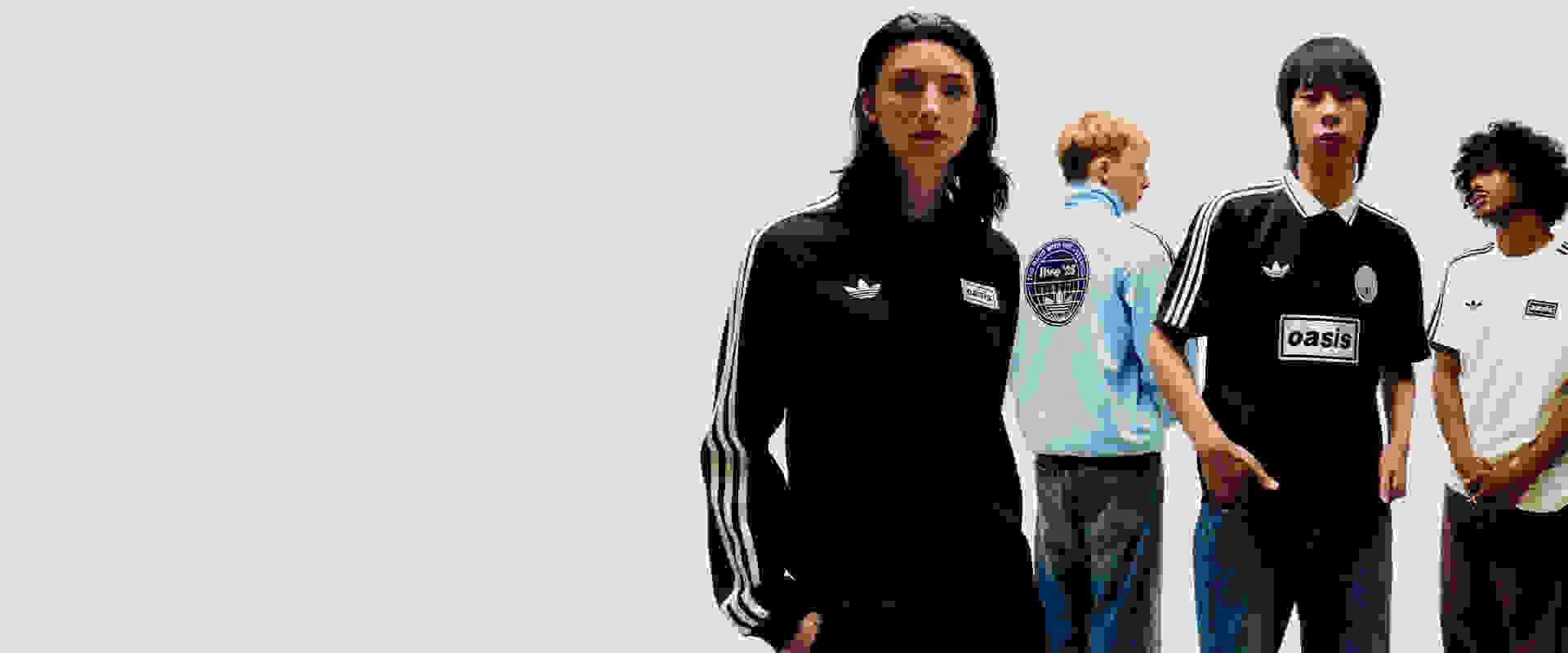 The image features three individuals wearing casual clothing, including a black hooded jacket, a light blue shirt, and a black shirt with white stripes. The background appears to be a plain, light-colored surface.