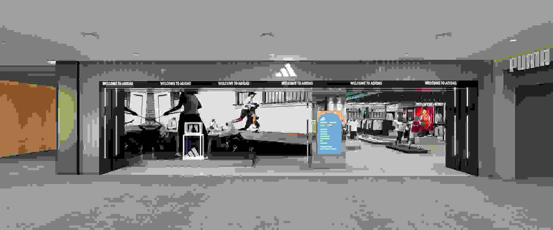 The image depicts the interior of an Adidas retail store, with a large display wall showcasing various Adidas products and branding. The foreground features a display stand with Adidas merchandise, while the background shows the store's interior design with a clean, minimalist aesthetic.