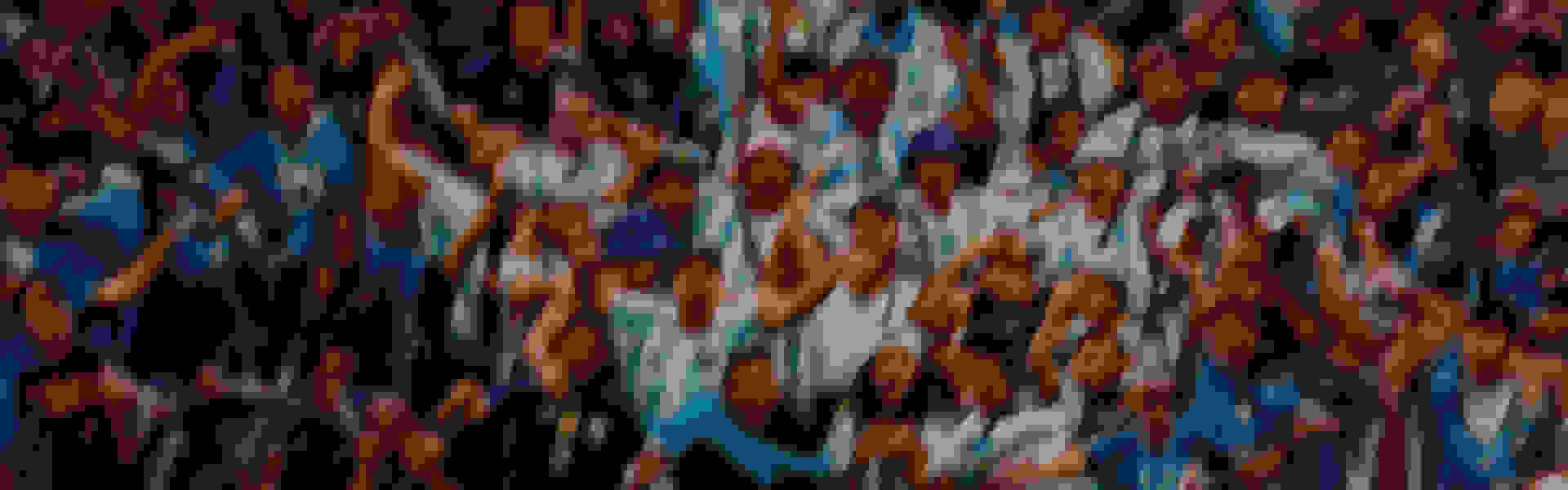 A blurred and abstract background with a mix of warm and cool tones, creating a visually striking and dynamic composition.