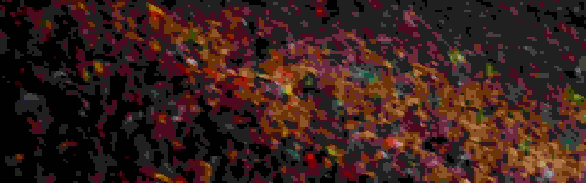 A vibrant, abstract background with a blurred, swirling pattern of various colors, including red, green, yellow, and blue.