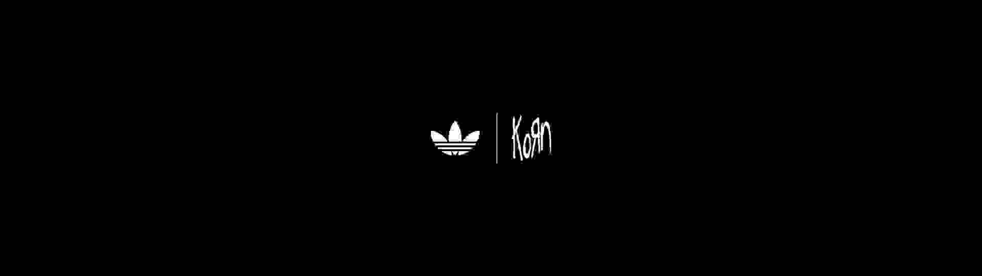 The image shows the adidas Originals x KoRn logo against a black background