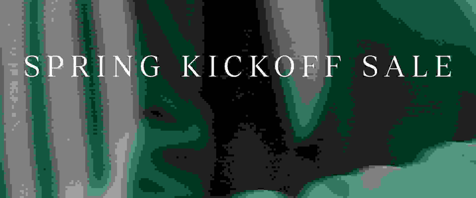 The image displays the text "PRING KICKOFF SAL" against a blurred, green background.