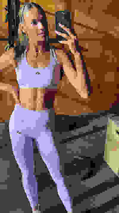 Image of model wearing the Optimé Collection in a gym environment. Hover over of another image with the same model doing a strength exercise.