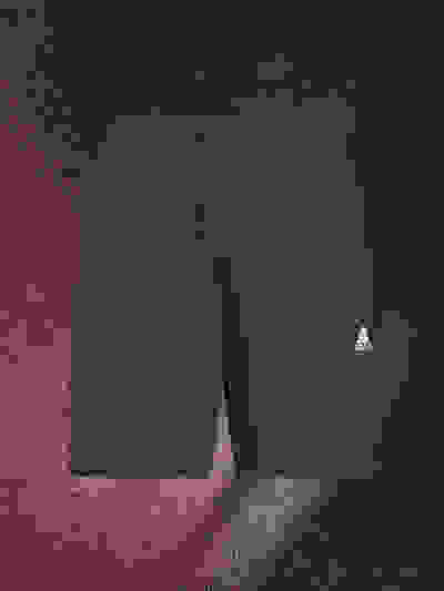 Navy blue Adidas athletic shorts on a dark, textured background.