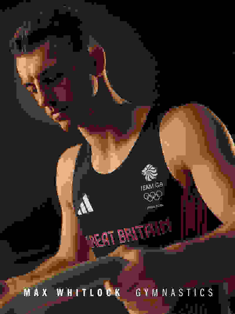 The image shows a young male athlete wearing a navy blue tank top with the "Team GB" logo, standing in a dimly lit setting with a serious expression on his face.