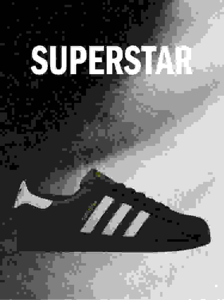 Black Adidas Superstar sneaker with white stripes on a dark background, with the word SUPERSTAR above.