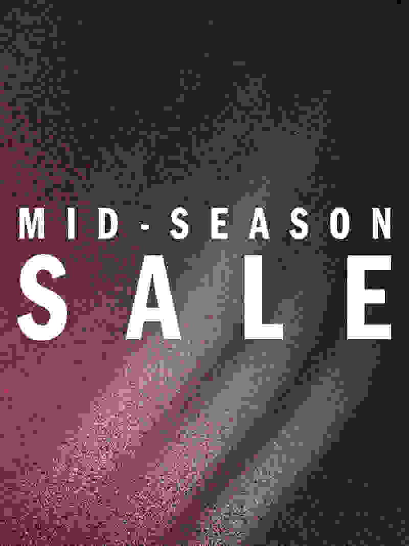 The image displays the text "MID-SEASON SALE" against a dark, textured background with a reddish hue, creating a dramatic and eye-catching visual.
