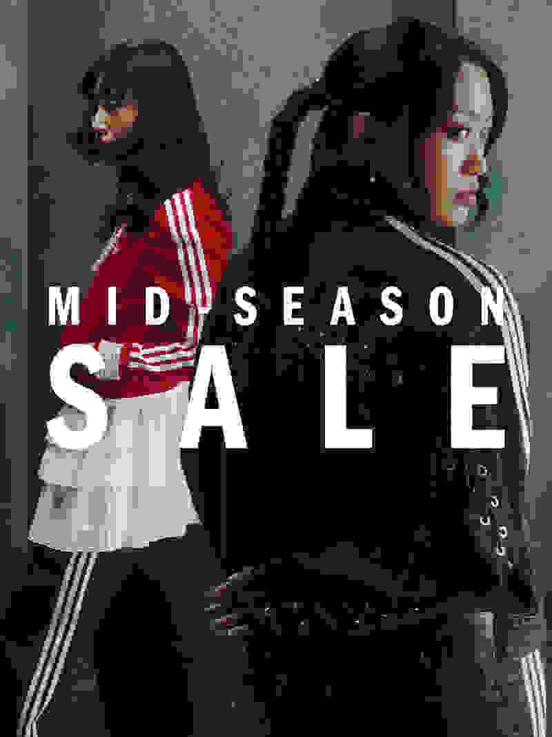 The image features two young women wearing contrasting outfits, with one in a red and white athletic-style top and the other in a black leather jacket, standing in front of a teal-colored background with the text "MID SEASON SALE" prominently displayed.