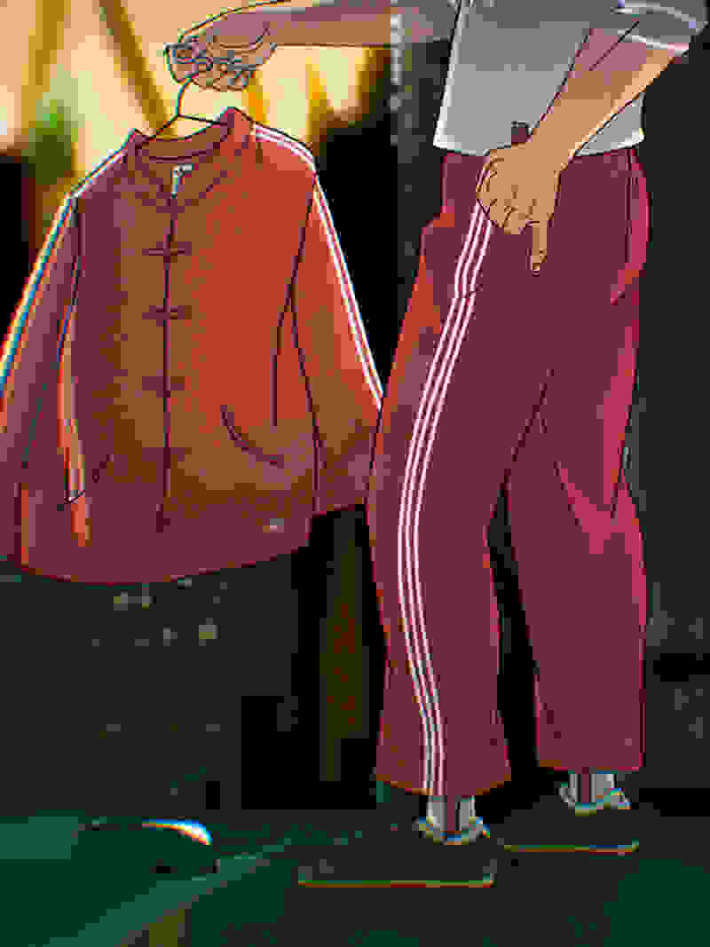 A red jacket and pants with white stripes are displayed in the foreground, with a blurred background suggesting an indoor setting.