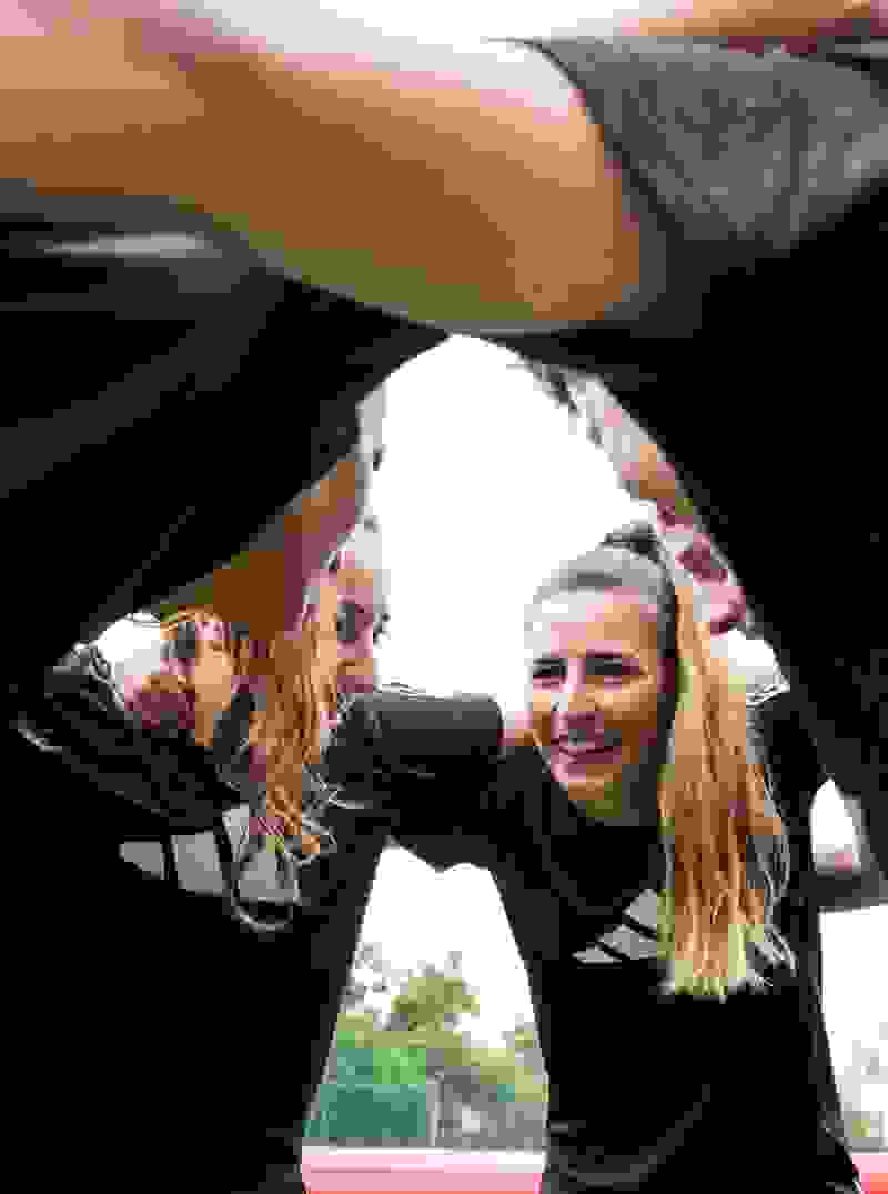 adidas-women-sports-team-huddling-black-tops