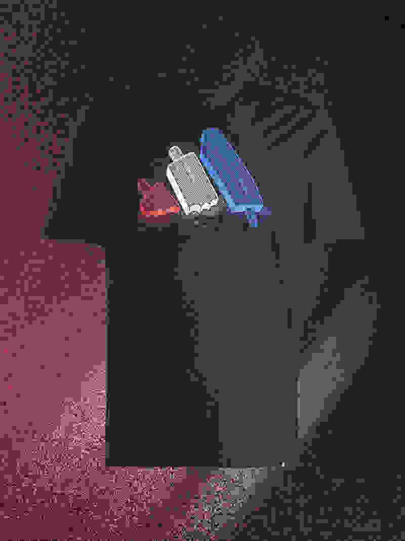 A black t-shirt with a colorful graphic design featuring three popsicle-like shapes in red, silver, and blue against a dark background.